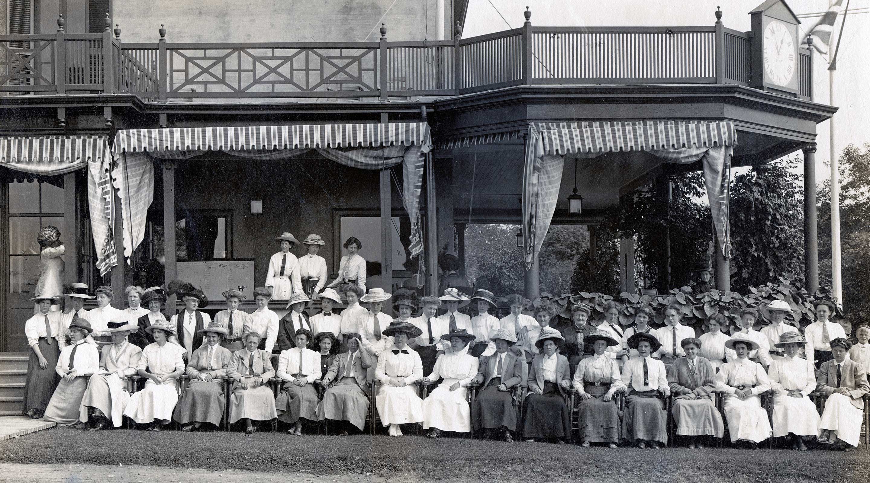 women in front of clubhouse